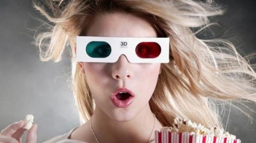 Woman wearing 3D movie glasses