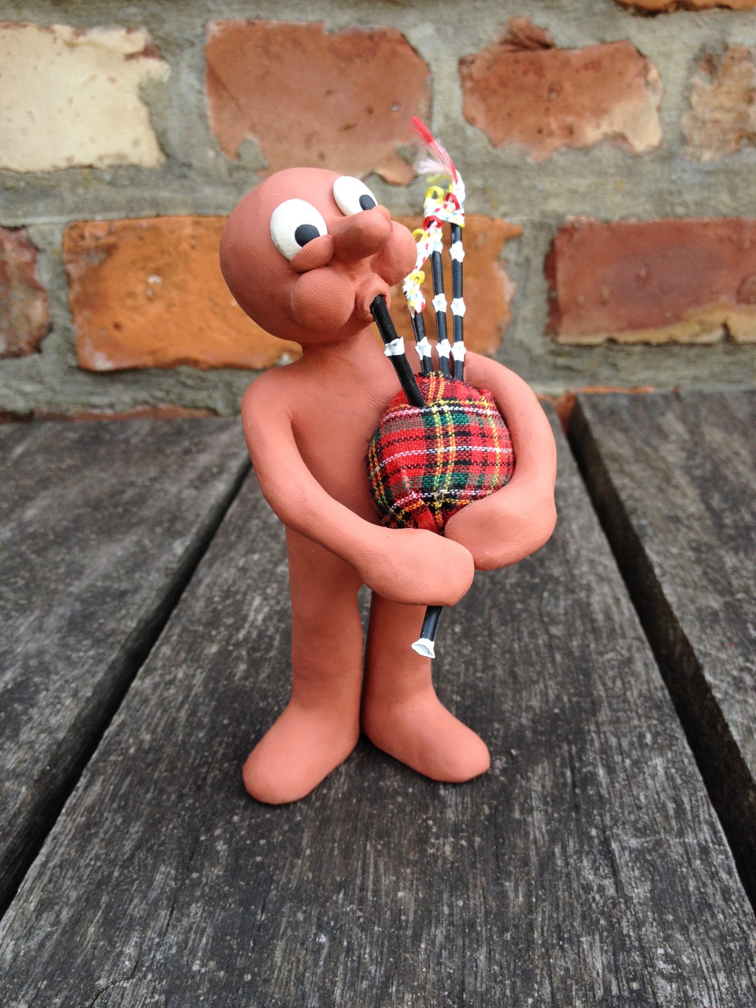 Morph playing the bagpipes